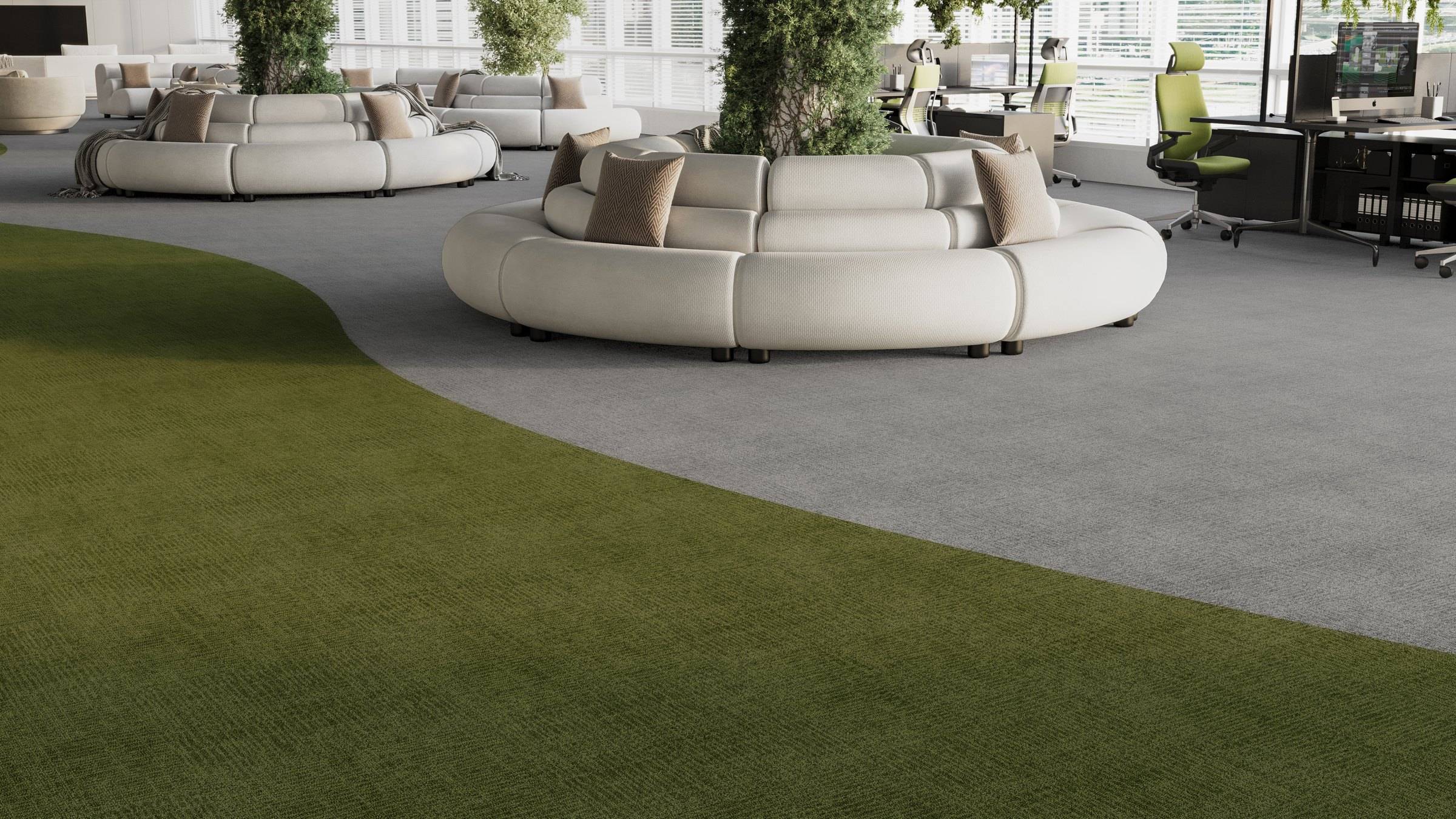 Lounge com sofás orgânicos e faixa curva de carpete verde-oliva sobre carpete cinza claro